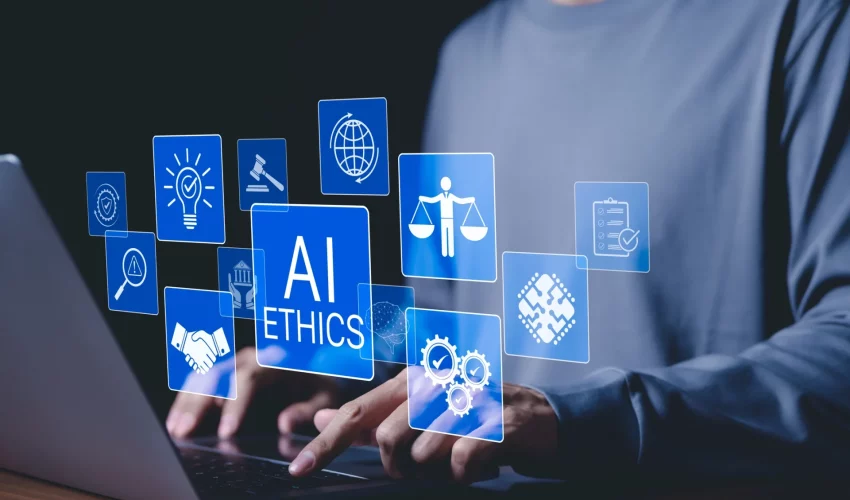 Telado com ícones azuis e a inscrição "AI ETHICS" sobre mãos digitando em um laptop, levando a reflexão até que ponto a IA pode ser usada de forma ética em estudos acadêmicos